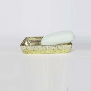 klart glas med guld dekalerade badrumstillbehör