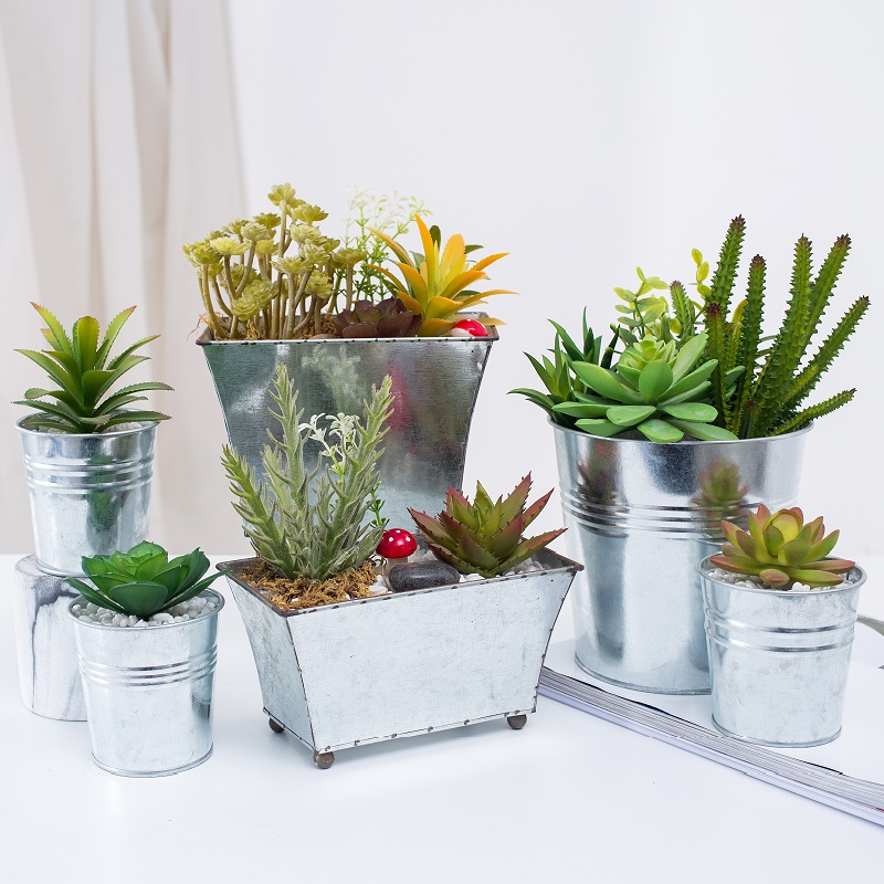Fabriks direktförsörjning Konstgjord succulent i järnkruka